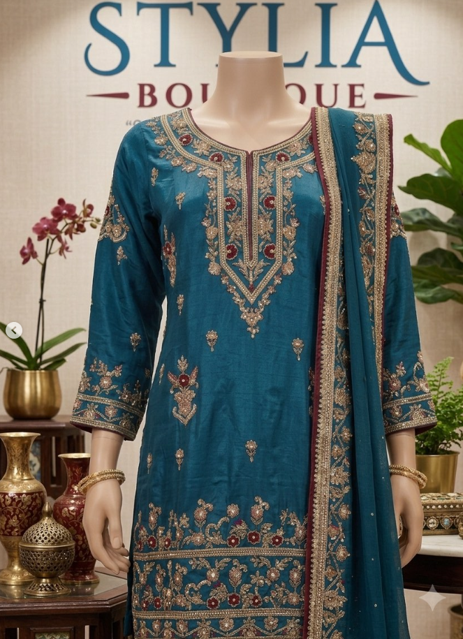Stylia Boutique — teal embroidered outfit close-up